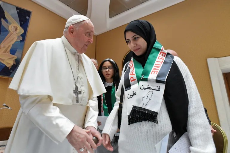 At the Vatican on November 22, 2023, Pope Francis meets with Palestinians whose relatives are stranded in Gaza where Israel has launched a relentless assault for the past 13 months [Vatican Media/­Handout via Reuters]